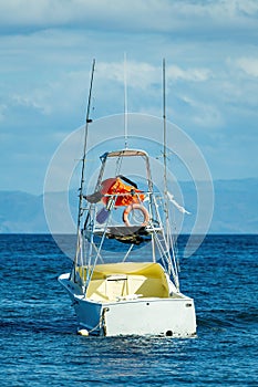 Motor boat anchored on Ocotal beach, Pacific ocean, El Coco Costa Rica