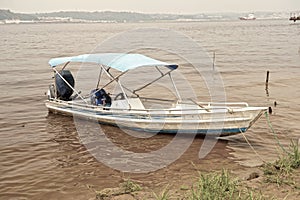 Motor boat on dirty water