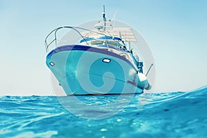 Motor boat floating clear turquoise water