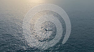 Motor boat floating sea shiny day aerial view. Ship sailing at marine landscape