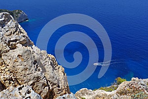 Motor boating on blue water - Zakynthos Island, landmark attraction in Greece. Ionian Sea. Seascape