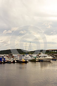 Motor boats on pier on Ladoga lake