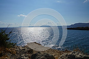 Motor boats sail on the Mediterranean Sea off the coast of Pefki in August. Rhodes Island, Greece