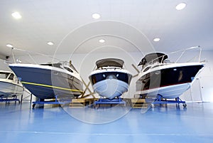 Motor boats in showroom or garage