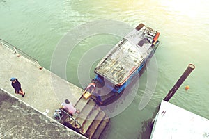 Motor boats water taxi parked docked along river