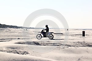 Motor crosser at beach of Ameland Island, Holland