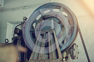 Motor driven with sling cable and wheel in control room