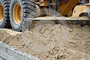 Motor Grader Shoveling Earth