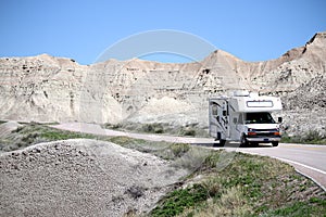 Motor home RV traveling into the Badlands National Park, South Dakota. photo