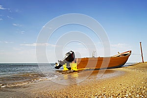 Motor rescue boat on the beach in sunny weather