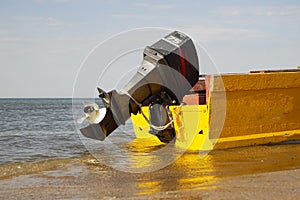 Motor rescue boat on the beach in sunny weather