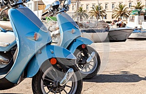 Motor Scooters Mopeds Motorbikes in a Mediterranean Fishing Village Harbor