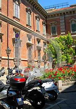 Motor scooters in street Brera Milan Italy