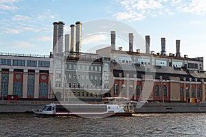 Motor ship in the background of the factory with same colors.