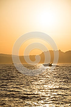 Motor speed boat at sunset