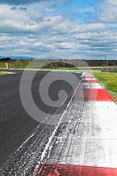Motor sport asphalt race track and curbs