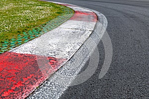 Motor sport asphalt race track and curbs