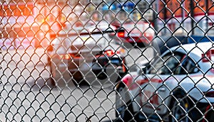 Motor sport car racing on asphalt road. View from the fence mesh netting on blurred car on racetrack background. Super racing car