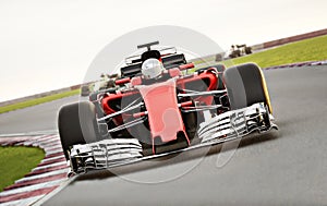 Motor sports competitive team racing. Fast moving generic race car leading the pack racing down the track with motion blur.