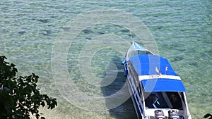 motor tourist speed boat tied up at sea coast