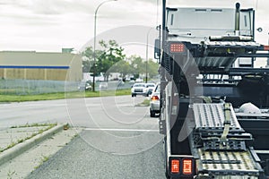 Motor Vehicle car transporter at road intersection
