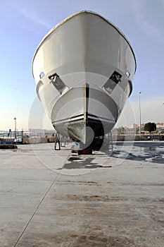 Motor vessel in drydock prepared for maintenance.