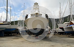 Motor yacht in boatyard photo