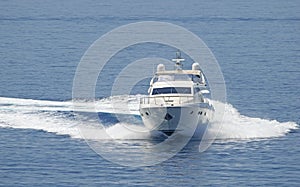 Motor yacht cruising the blue sea.