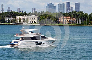 Motor Yacht cruising by Star Island in Miami Beach,Florida