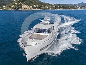 Motor yacht in navigation aerial view