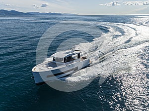 Motor yacht in navigation aerial view