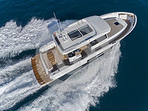 Motor yacht in navigation aerial view