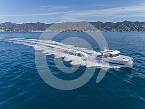 Motor yacht in navigation aerial view