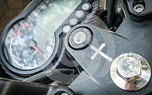 Motorbike with crucifix symbol near ignition key slot,Mysuru,Karnataka,India