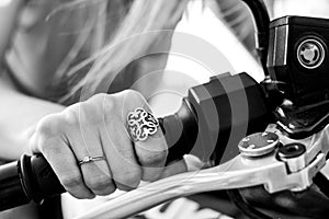 Motorbike details, woman riding on bike.