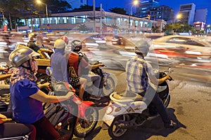 Motorbike drivers at the crossroad, Ho Chi Minh City