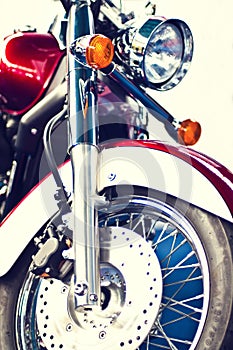 Motorbike front view of a wheel and disk brakes