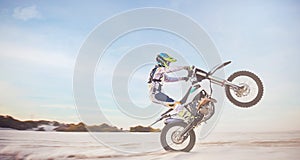 Motorbike, motorcycle athlete and desert drive with mockup cycling in nature for sport adventure. Jump, freedom and