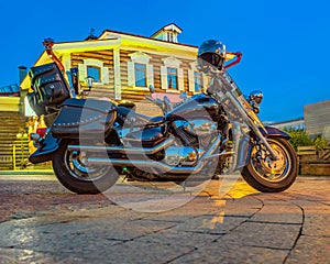 Motorbike is parking on the street of the night city