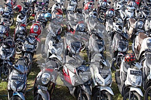 Motorbike parking on the street. Ubud, Indonesia