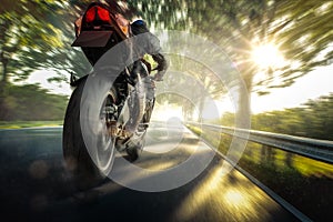 Motorbike rider on a country road