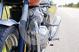 Motorbike side detail parked aside road vintage Motorcycle detail