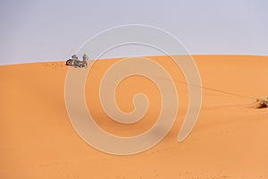 A motorbiker driving off-road in the Erg Chebbi desert became stuck in the sand