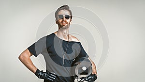 Motorbiker Posing In Studio, Isolated On Grey