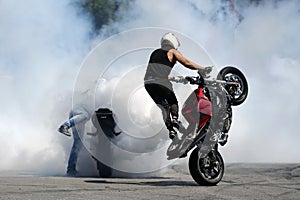 Motorbikes drift white smoke wheel