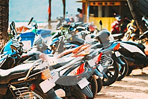 Motorbikes, motorcycles scooters parked in row in city street. Close up of details. Bikes