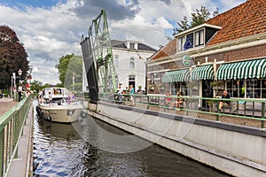 Motorboat going under the bridge in Blokzijl