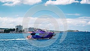 Motorboat leaving sea bay