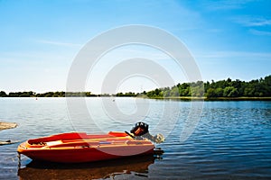 Motorboat moored on a lake on a warm summer day in England, UK