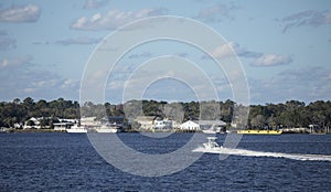 A motorboat moves across the water toward St Marys, Georgia waterfront photo